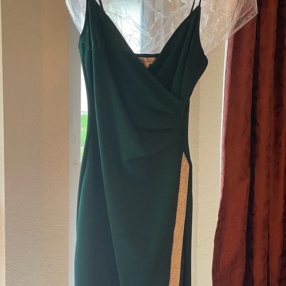 Honey and Rosie, size Med, Emerald Green long dress with sequined side slit.